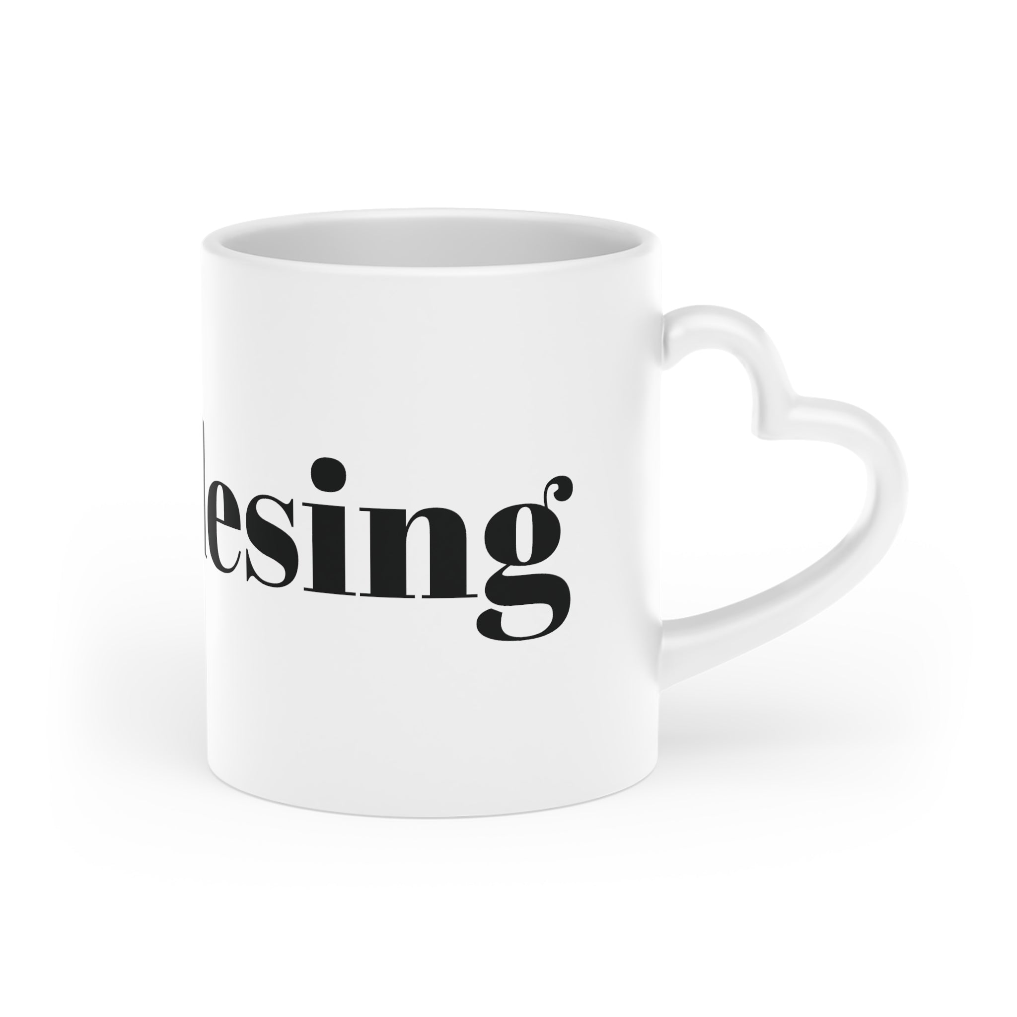 White sublimation mug with printed design and heart-shaped handle, showcasing custom creativity.