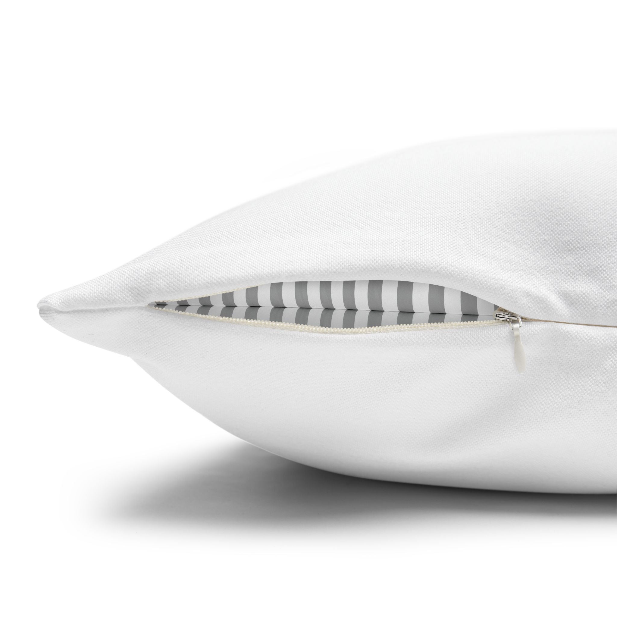 Close-up of a white personalized pillow cover with a hidden zipper and striped lining.