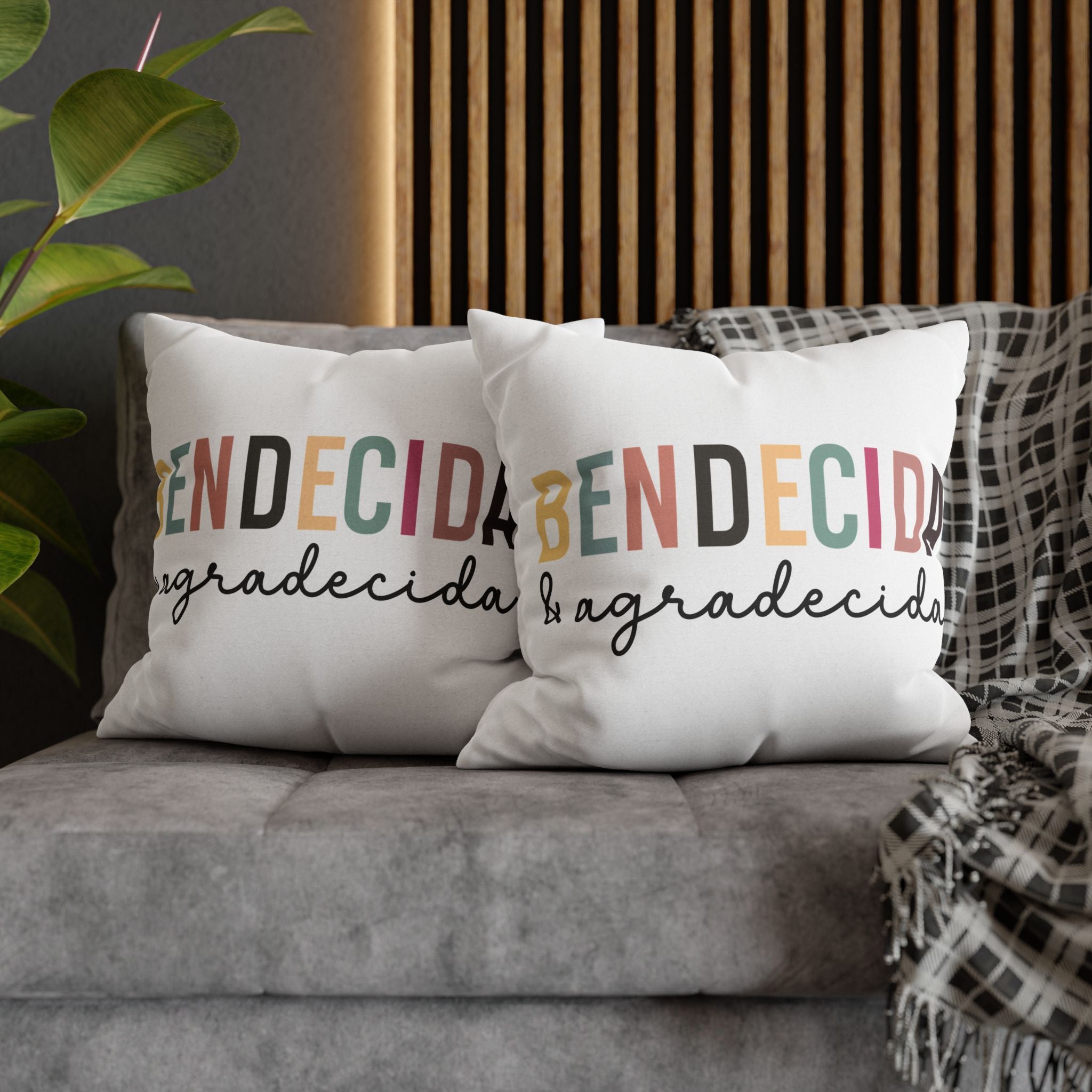 Cozy personalized pillow covers with the word 'Bendecida' and 'Agradecida' in stylish typography on a couch.