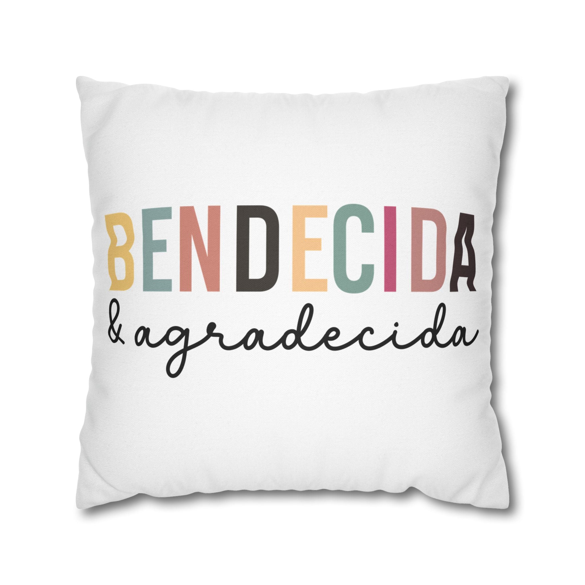 Personalized pillow cover with the words 'Bendecida & agradecida' in colorful letters, adding style to any space.